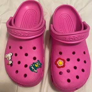 Hot pink crocs with extra charms